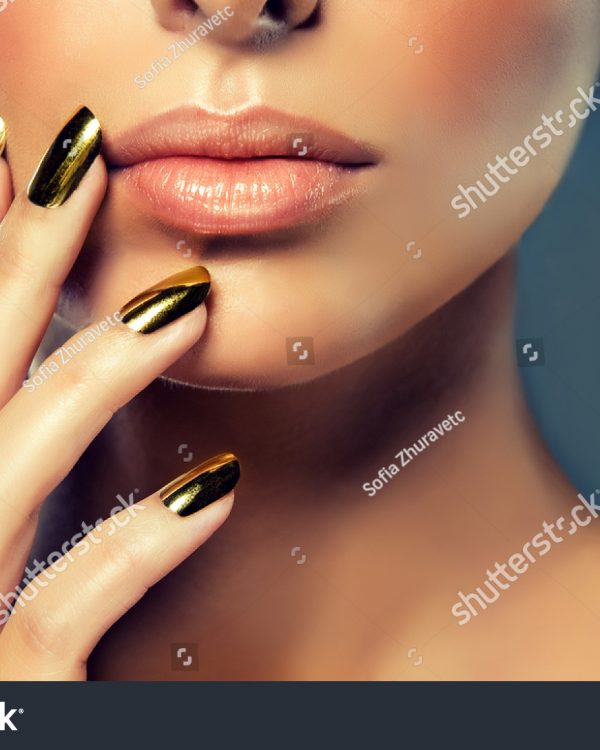 stock-photo-beautiful-girl-with-the-golden-makeup-and-gold-metal-nails-fashion-woman-portrait-404479519