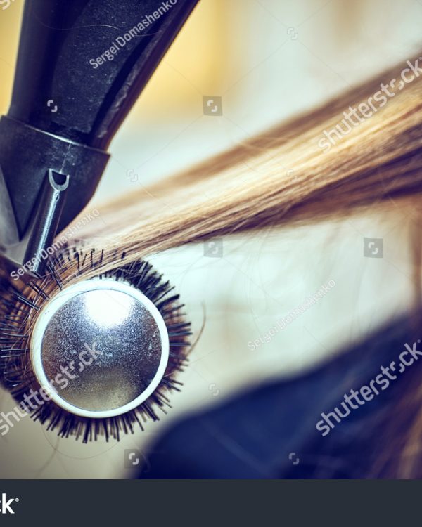 stock-photo-professional-hairdresser-drying-hair-in-studio-578124061